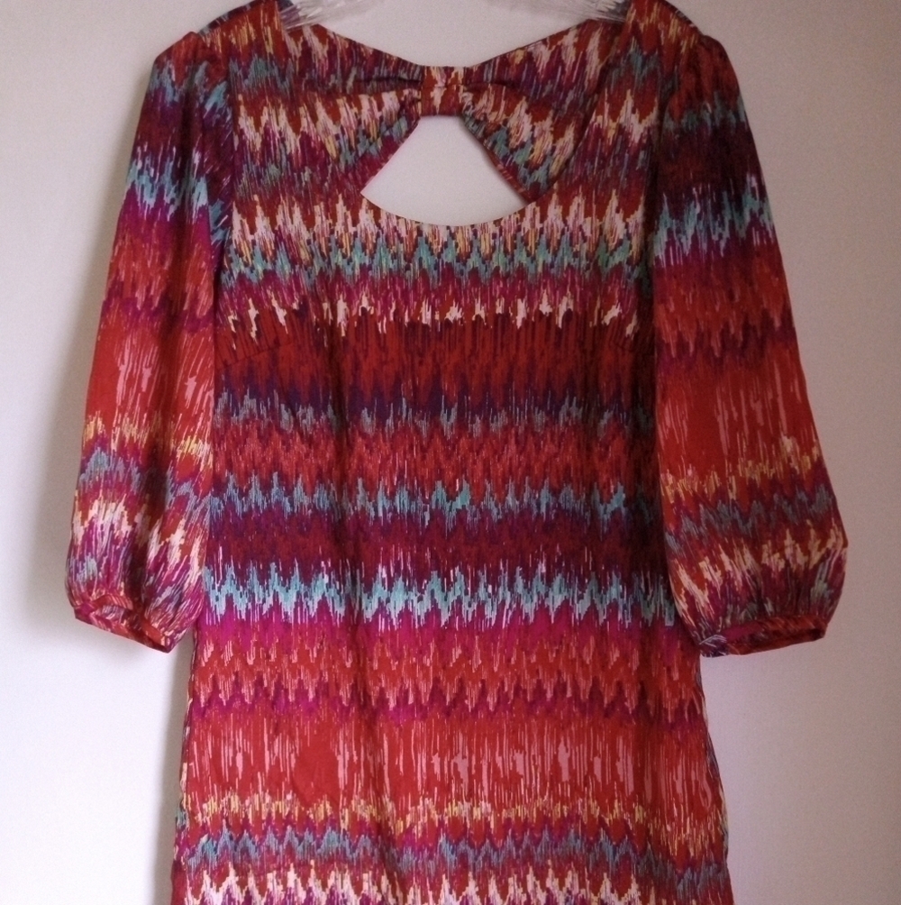 Lily Rose a-line mini dress with 3/4 length puff sleeves and back cutout